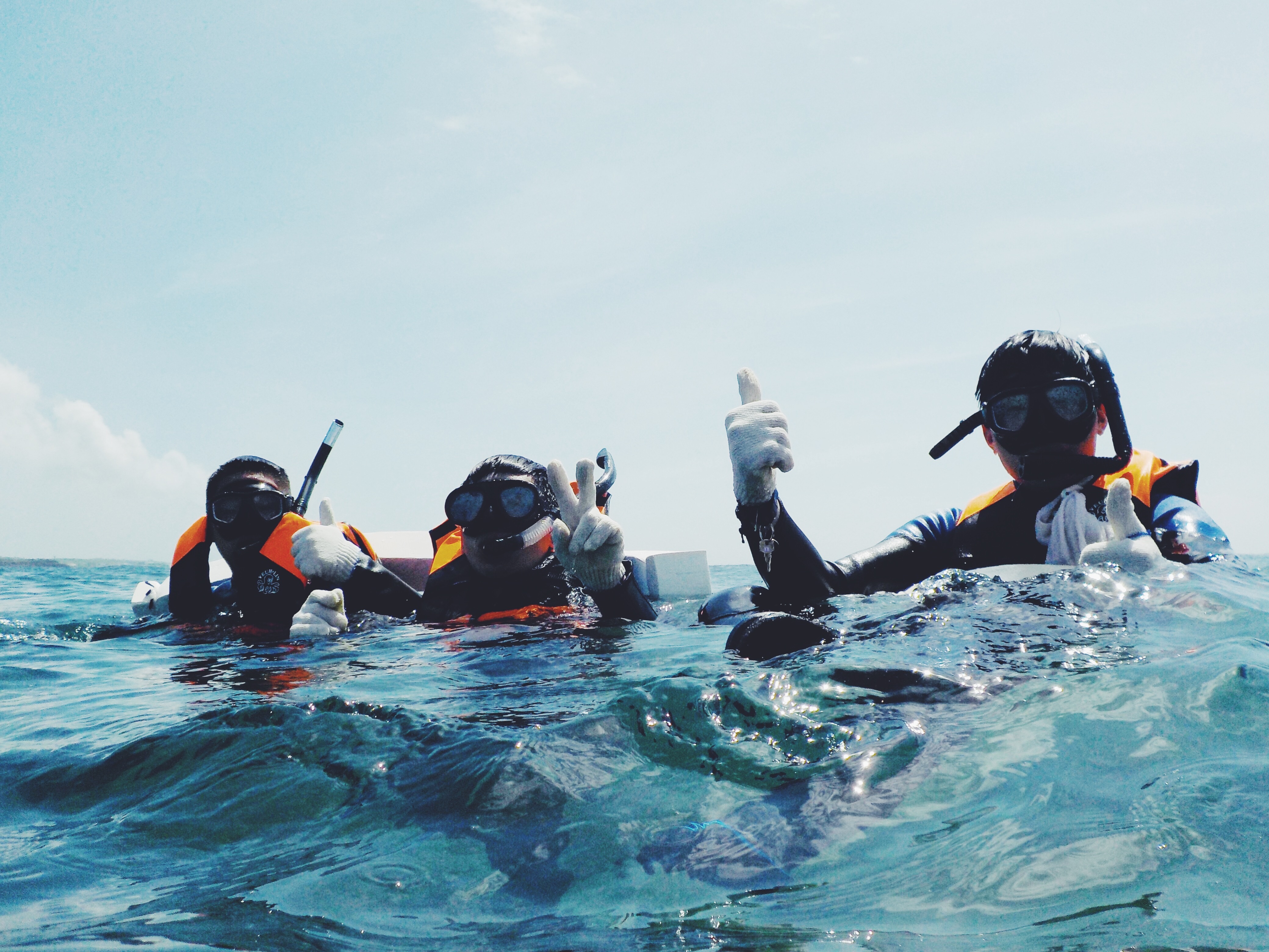 Scuba divers on the surface - thumbs up
